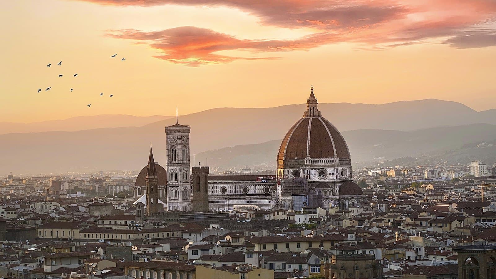 Florence skyline at sunset with the cathedral dome and bell tower